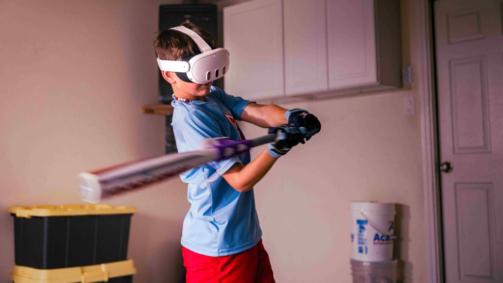 Image of a young baseball player hitting a ball