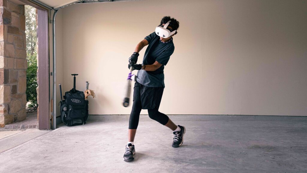 Image of a baseball player using WIN Reality in the garage